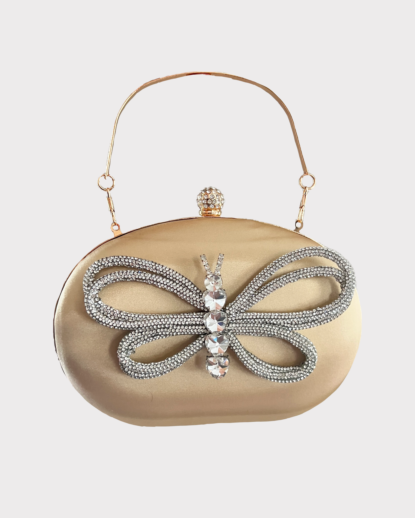 premium gold colored clutch purse bag in high quality fabric with crystal rhinestone work forming a buterfly design, with 2 optional handles and securely locking clutch in an attractive pattern by Oviya