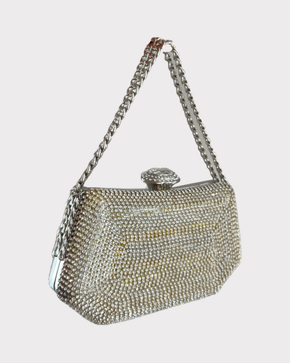 premium silver white colored clutch purse bag with high quality fabric with crystal rhinestones work with chain handle and securely locking clutch in an attractive pattern by Oviya 
